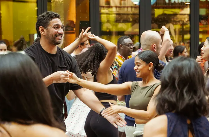 A joyful group dancing together at a social event