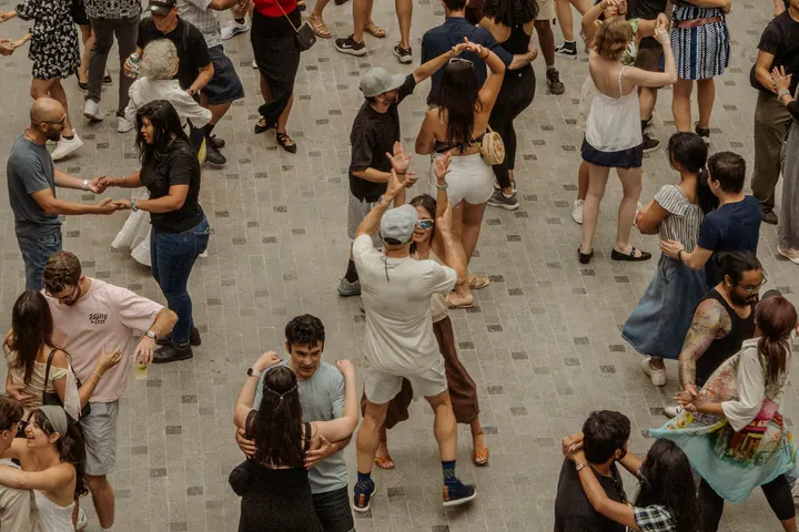 An overhead view of many couples dancing together